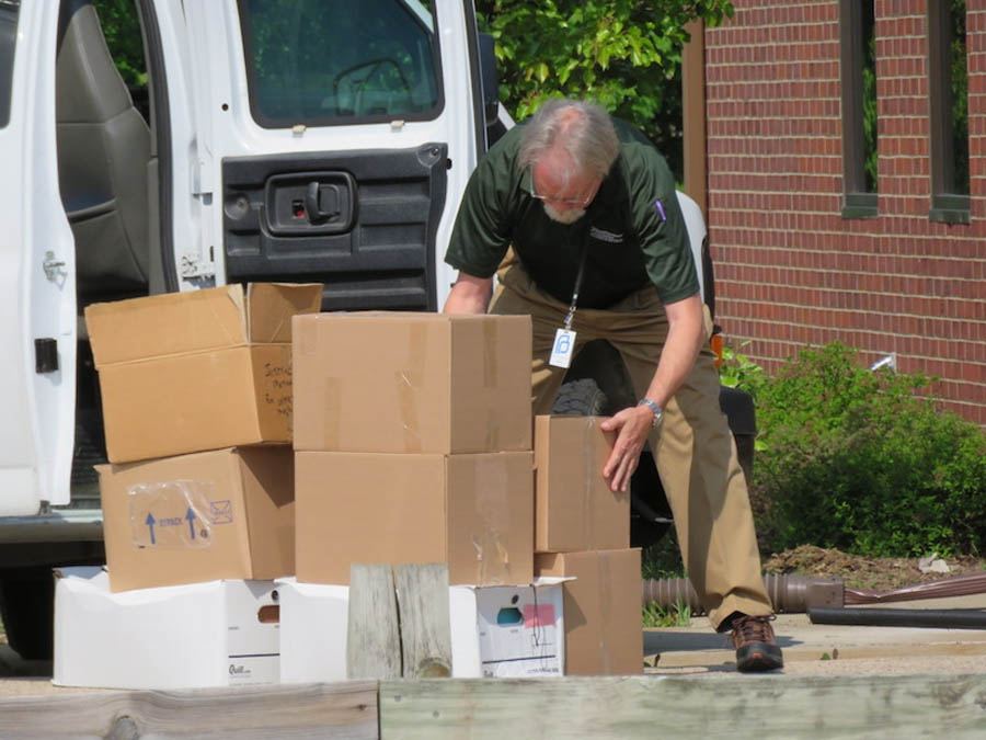 Planned Parenthood of the Heartland's Brant Morgan collects boxes of personal health information May 16 that Planned Parenthood knowingly left unattended for 10 days.