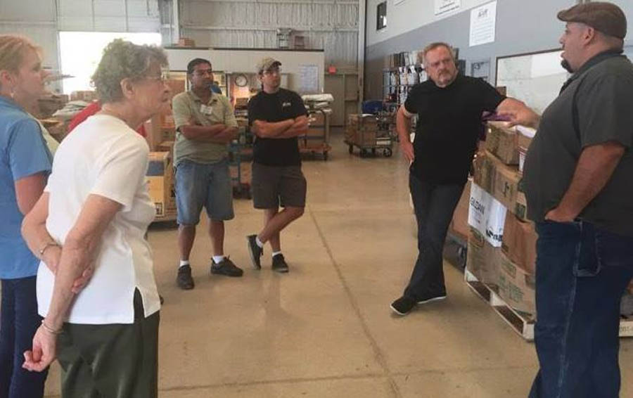 Joseph Pardo (right) prepares a supply run to Puerto Rico following Hurricane Maria.