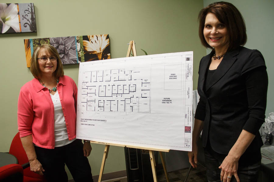 Fallbrook Pregnancy Resource Center executive director Carolyn Koole, left, and Fallbrook Pregnancy Resource Center brand manager and Mission Continues fellow Rhonda Schlumpberger, with blueprints outlining the center’s future expansion plans. 