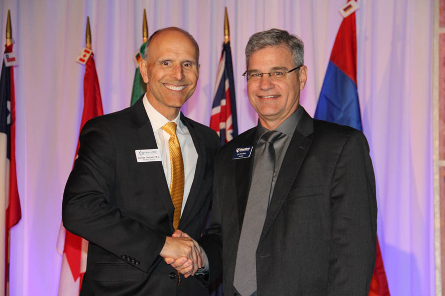 Dr. George Delgado (left) with Heartbeat International president Jor-El Godsey.
