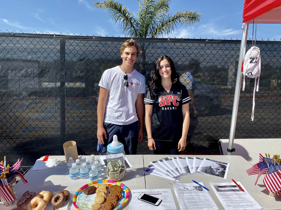 Pietro Lanza and Madison Zeigler at their pro-life display during their high school's homecoming football game